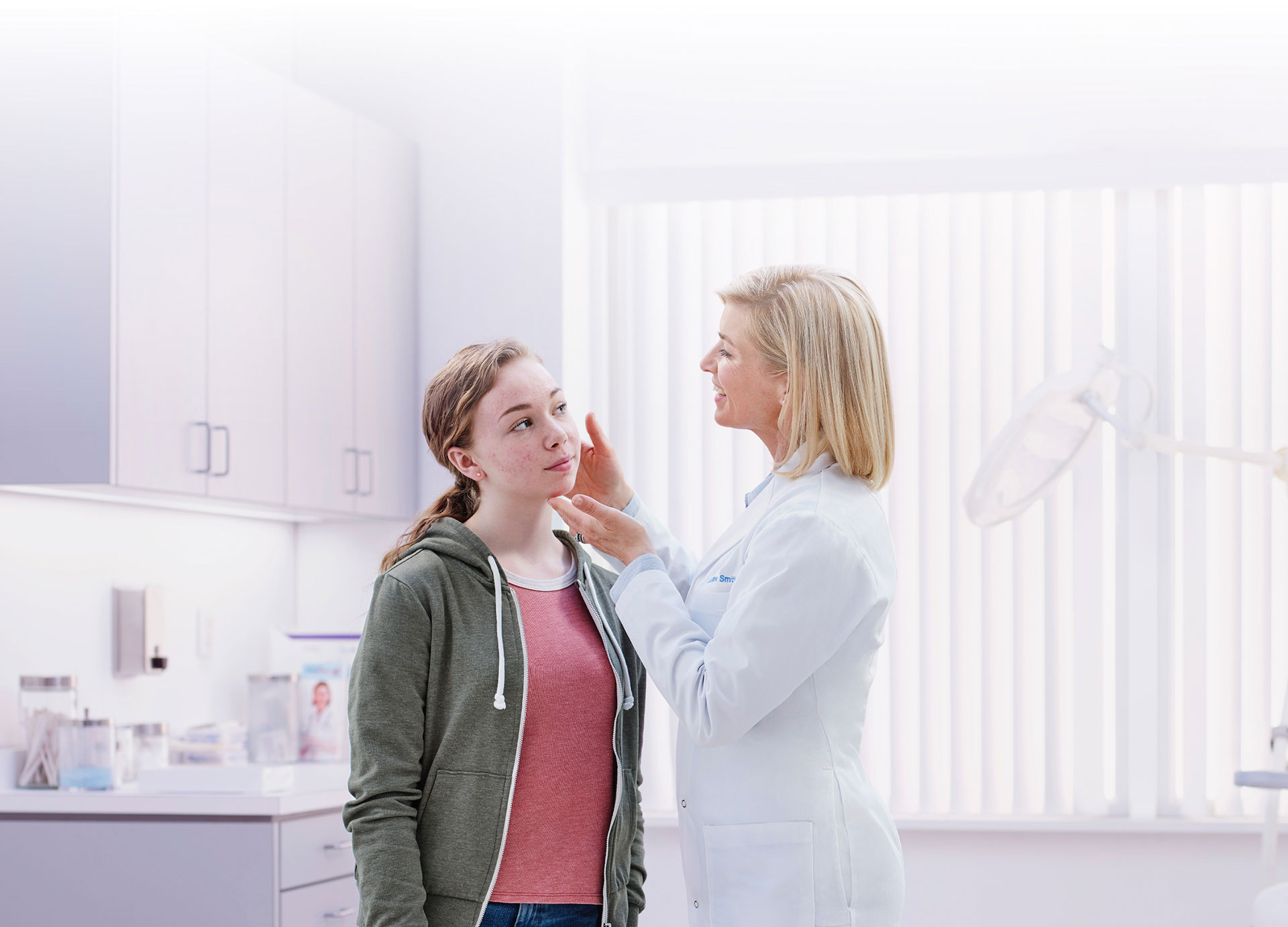 A young woman being examined by a doctor
